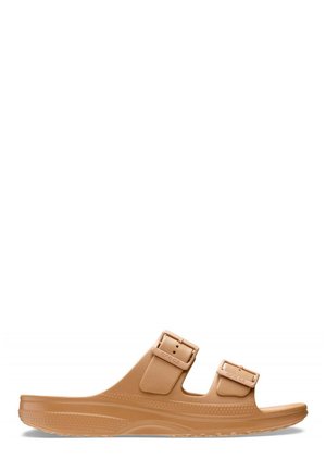Sandalo slip-on marrone chiaro con due cinturini regolabili con fibbia e suola testurizzata progettata per comfort e uso casual.
