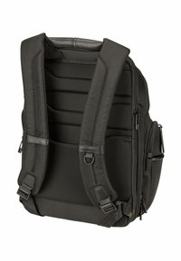 Sac à dos noir rembourré avec panneau dorsal en mesh, bretelles réglables, poches latérales et plusieurs compartiments zippés, vu de l'arrière.