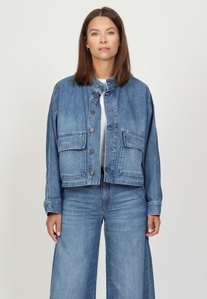 Denim jacket featuring a cropped design, light blue color, two front pockets, and button closure with a stand collar.