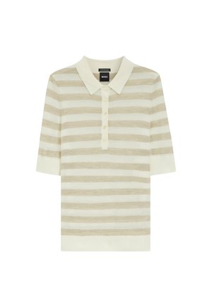 Polo a maniche corte color crema e beige a righe con apertura a bottoni e colletto morbido, adagiato su uno sfondo bianco.