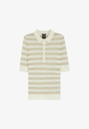 Polo a maniche corte color crema e beige a righe con apertura a bottoni e colletto morbido, adagiato su uno sfondo bianco.