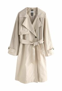 Beige trench coat dengan kerah besar, lengan panjang, sabuk ikat, dan detail kancing. Kain halus dengan potongan santai dan saku.