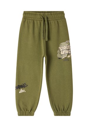 Pantaloni felpati verde oliva con vita elastica e cordino. Presentano stampe grafiche in bianco e nero sulle gambe inferiori.
