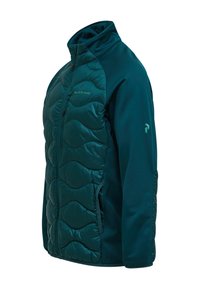 Giacca trapuntata color verde-teal con maniche in tessuto morbido, cerniera frontale, tasca sul petto con cerniera e logo sul petto e sulla manica sinistra.