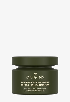 Tarro verde oscuro con un acabado mate suave y una tapa ancha y plana. Texto dorado etiqueta el producto como "Crema de Recuperación Nocturna Mega-Hongos."