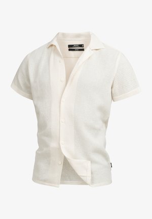 Kortärmad, knappad skjorta i ett texturerat, ljust krämfärgat tyg med krage och subtilt öppet vävmönster. Har fem knappar.
