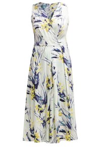 Robe sans manches en tissu léger avec une base blanche ornée de motifs floraux jaunes et violets, dotée d'un décolleté en V et d'une coupe portefeuille.