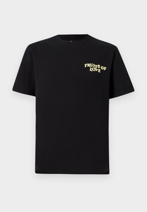 Black cotton t-shirt featuring a yellow "FRUITS OF LOVE" print on the left chest. Classic crew neck and short sleeves. Smooth texture.