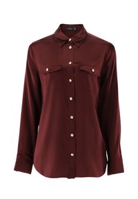 Long-sleeve burgundy satin blouse with gold buttons and two chest flap pockets, classic collar, and buttoned cuffs.