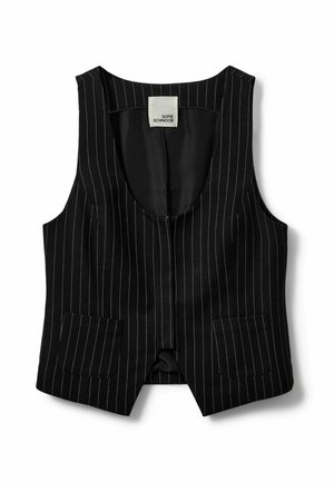 Mustassa raidallisessa hihattomassa liivissä on kaksi etutaskua, pyöreä kaula-aukko ja kauluksessa lukee "Sofie Schnoor".