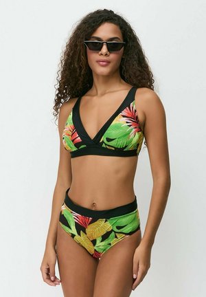 Tropical patterned bikini set featuring a black base with green, yellow, and red leaf designs; bra-top with a v-neck and high-waisted bottoms.