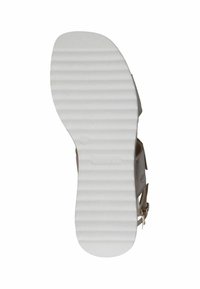 Suola di scarpa in gomma bianca con scanalature orizzontali e punta arrotondata. Presenta un'area con marchio vicino al tallone. Progettata per comfort e aderenza.
