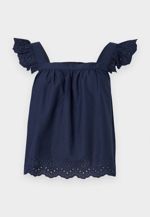 Tumesinine varrukateta pluus ruudukujulise kaelusega, volditud puuvillase pitsiga varrukate ja lainelise servaga silmapilgutusega kaunistustega.