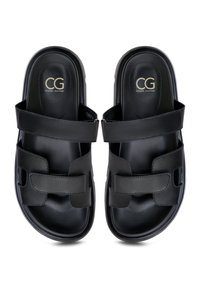 Black sandals with two wide straps and a cushioned footbed. Features embossed logo "CG" on the insole and a smooth, glossy finish.