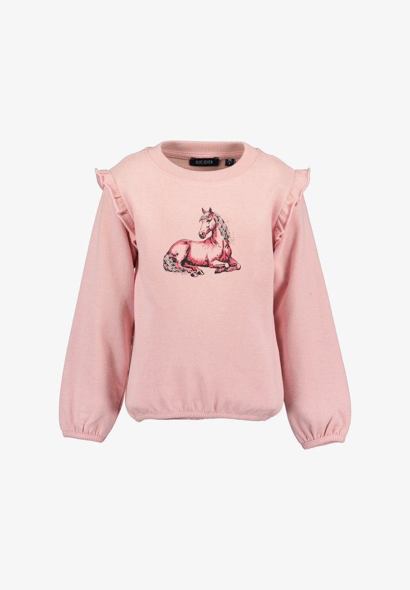 Sweatshirt rose clair avec des accents en volants aux épaules. Présente une illustration imprimée d'une licorne se reposant sur le devant.