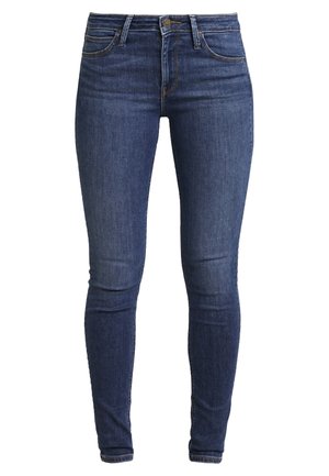 Dark blue skinny jeans made of denim, featuring a high waist, five-pocket design, and subtle stitching details. Smooth texture and fitted shape.