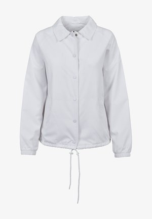 Valge kerge jakk kraega, nööbiga sulgemine, elastsed mansetid ja reguleeritava sobivuse jaoks paelaga alumine serv. Sile tekstuur.