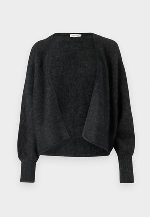 Melna adīta kardigāna žakete, kas izgatavota no mīkstas vilnas, ar brīvu piegriezumu, atvērtu priekšpusi un garām, nedaudz sašaurinātām piedurknēm. Poga vai aizdare nav redzama.