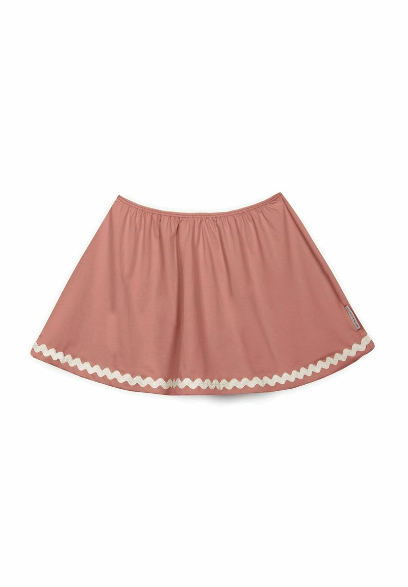 Falda de algodón rosa con cintura elástica, forma acampanada y borde con un trim en zigzag blanco. Textura suave y diseño hasta la rodilla.