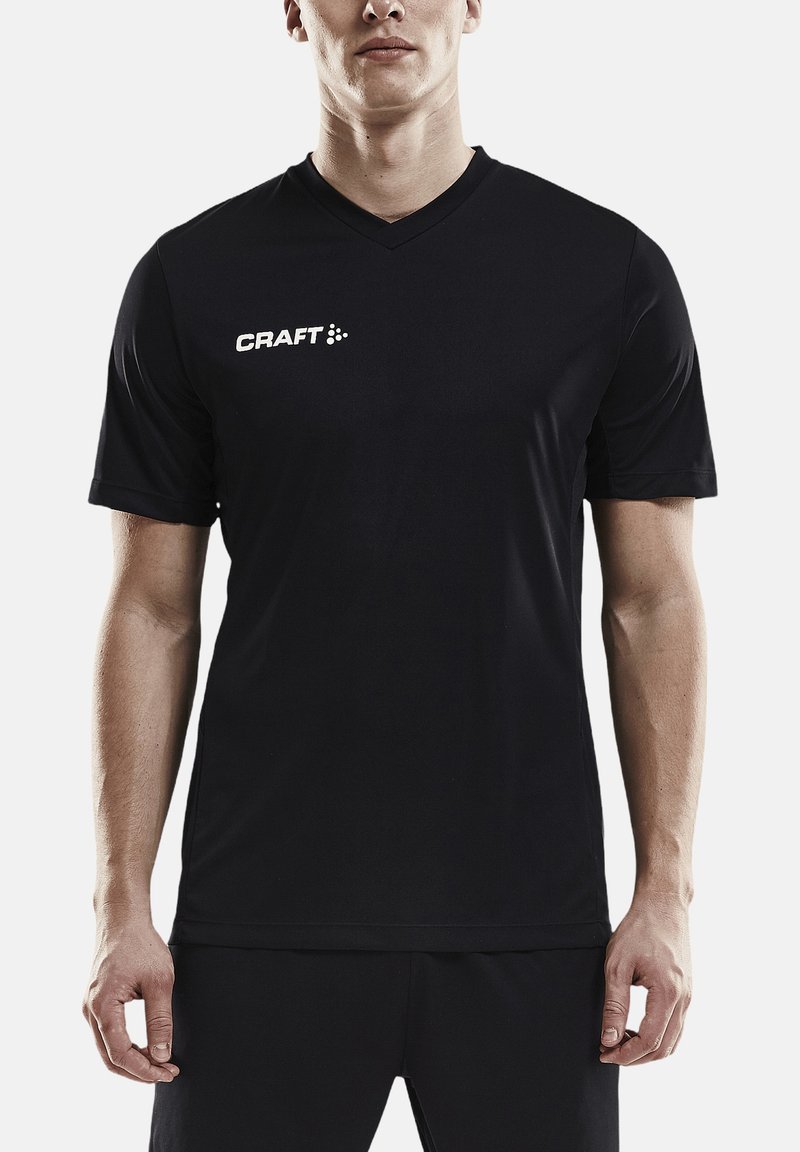 Camisa deportiva negra de manga corta con diseño de cuello en V. Presenta el logotipo "CRAFT" en blanco en la parte izquierda del pecho. Material sintético suave.