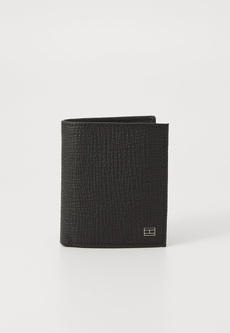 Black wallet made of textured material. Folded design with a small silver logo on the front. Features multiple card slots inside.