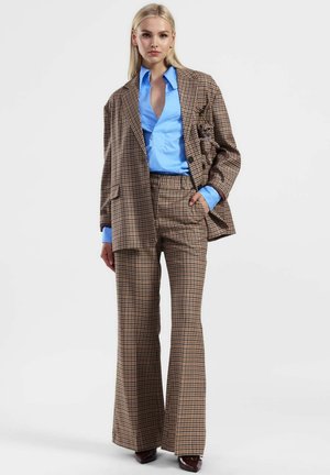 FLARE A QUADRI - Pantaloni - moro beige