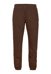 Bruine sweatpants gemaakt van zachte stof, met een elastische tailleband met koord, zijzakken en taps toelopende elastische boorden.