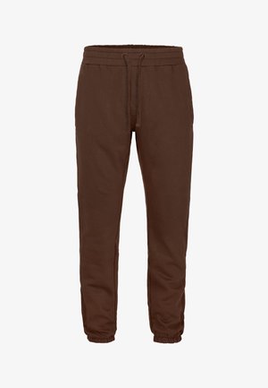 Braune Jogginghose aus weichem Stoff, mit elastischem Bund und Kordelzug, Seitentaschen sowie zulaufenden, elastischen Bündchen.