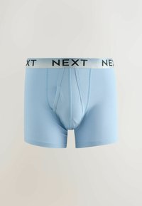Boxer bleu clair pour homme avec une ceinture argentée affichant le logo noir "NEXT", présenté sur un fond clair et neutre.
