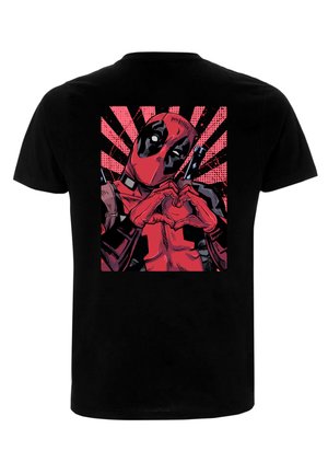 Black T-shirt featuring a graphic print of a character forming a heart shape, background with red rays and comic-style dots in pink.