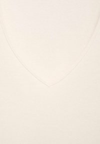 V-Ausschnitt Pullover aus weichem, hellbeigem Stoff. Verfügt über eine glatte Textur und ein minimalistisches Design mit einem dezenten gerippten Finish.