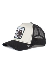 Gorra de camionero con un frente crema, espalda de malla negra y visera negra. Presenta un diseño de vaca bordado con la palabra "CASH".