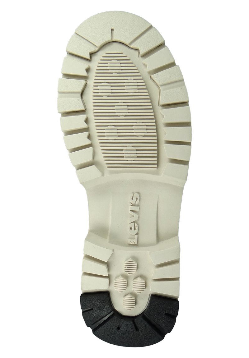 Witte rubberen zool met een zwarte hak, voorzien van een gestructureerd grippatroon en verhoogde accenten. "Levis" logo in reliëf op de middenzool.