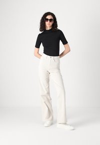 ONLY Tall ONLHOPE GLOBAL HIGH WAIST WIDE  - Trousers - pumice stone