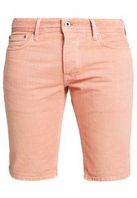 Shorts de algodón de color melocotón con corte recto, diseño de cinco bolsillos, que cuentan con una cremallera y un botón de cierre, además de una textura sutil.