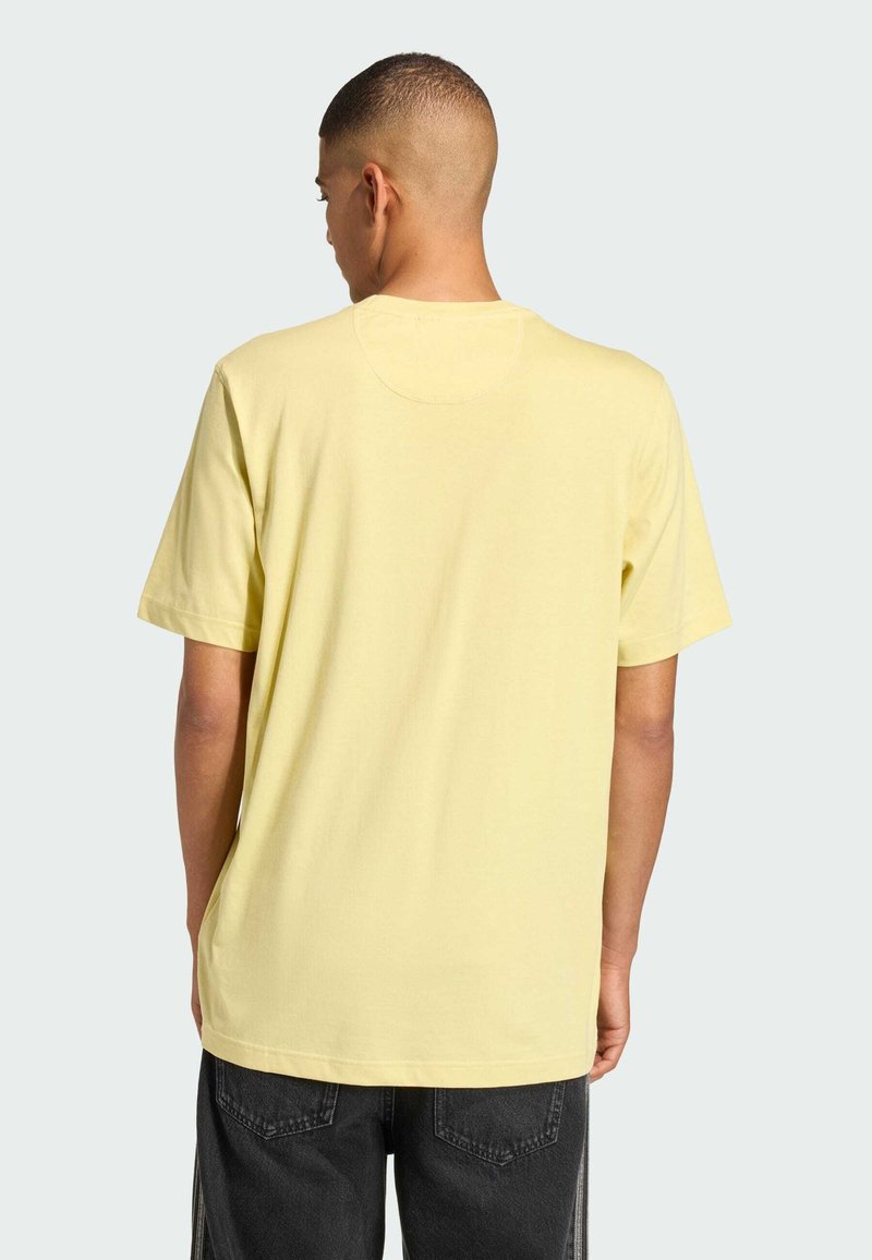 Yellow short-sleeve t-shirt with a rounded neck, smooth texture, and a relaxed fit. Back view shows simple design with no graphics or accents.
