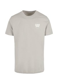 T-shirt in cotone grigio con maniche corte e collo rotondo, con un logo a scudo bianco che recita "AZZURRO ITALIA" davanti nell'area del petto sinistro.