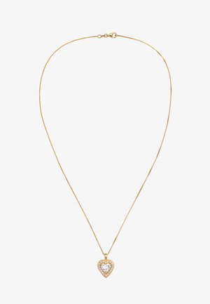Collier en chaîne dorée avec un pendentif en forme de cœur, doté d'un grand cristal au centre, entouré de petites pierres claires.