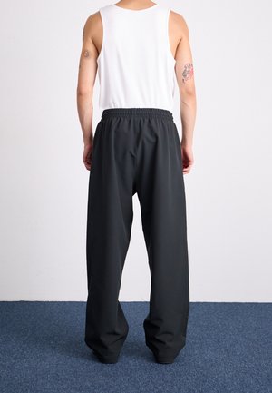 Pantalones deportivos - black