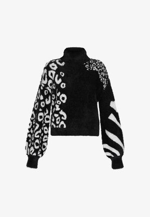 Black and white cropped sweater with a high collar, featuring varied patterns: abstract spots, leopard, and zebra stripes on soft, textured fabric.