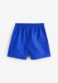 Maillot de bain bleu avec une ceinture élastique, comportant une poche arrière avec fermeture à pression et un tissu lisse et léger.