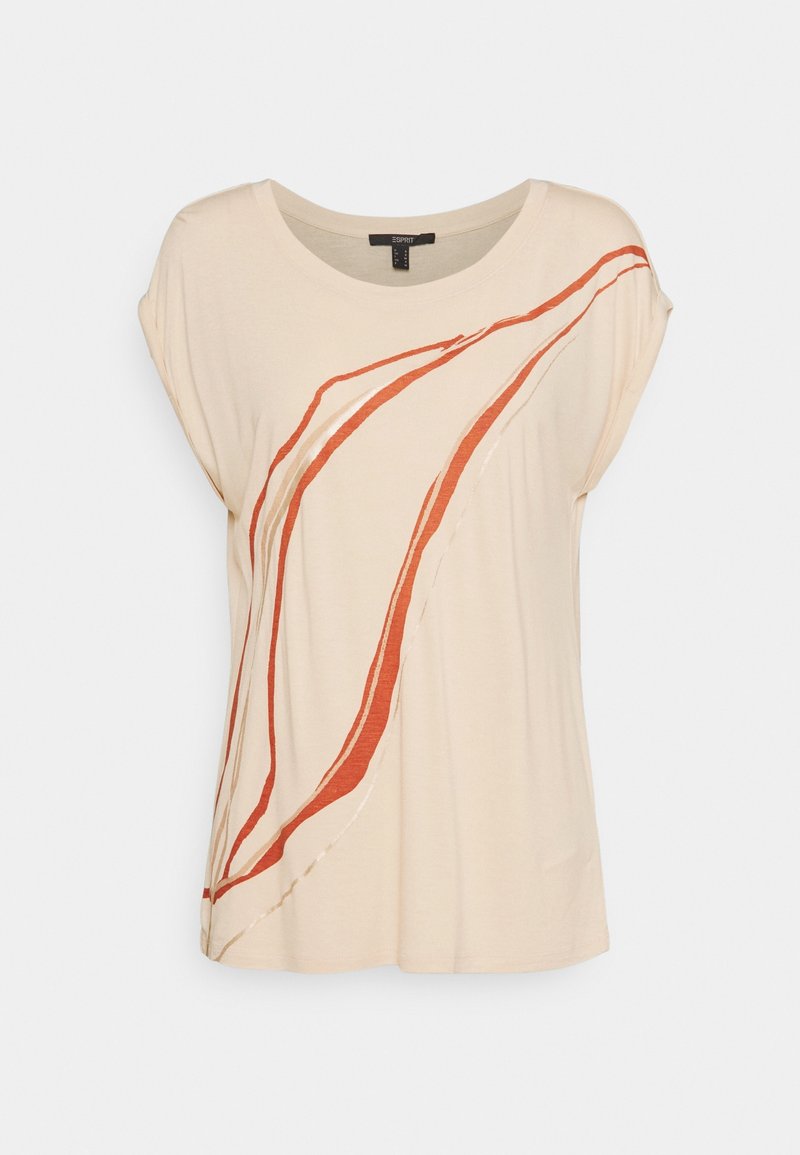 Beige T-shirt with loose sleeves, featuring abstract red and white lines. Made of soft material with a round neckline and relaxed fit.