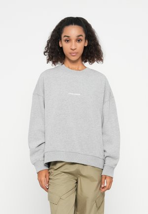 Gray sweatshirt with a round neckline, dropped shoulders, and ribbed cuffs. It features a subtle "PEGADOR" logo in white on the front.