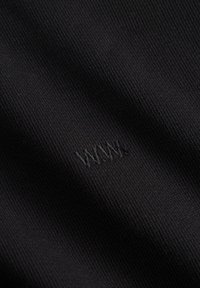 Black fabric with a textured weave featuring the embroidered letters "WWW" in a subtle dark thread.