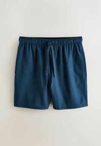 Short bleu marine texturé avec taille élastique et cordon devant, posé à plat sur un fond clair.