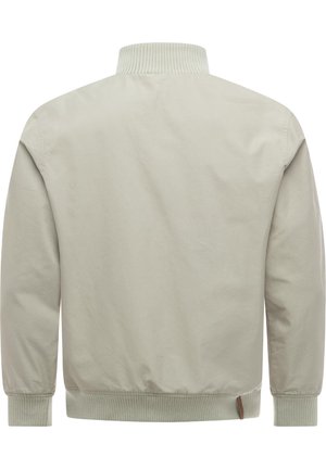 Lys beige bomberjakke med ribbet krage, mansjetter og midjebånd, vist bakfra, med en liten lærmerk ved kanten.