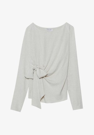 Long-sleeve top in light beige linen blend, featuring a twisted knot detail on one side, round neckline, and a loose fit.