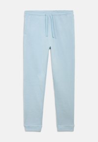 Světlé modré tepláky z měkké látky, s elastickým pasem se šňůrkou a dvěma bočními kapsami. Přiléhavé manžety u kotníků.