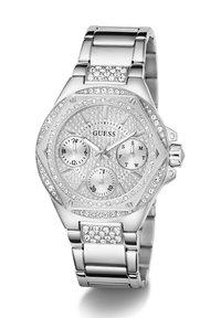 Montre en acier inoxydable argenté, de forme octogonale, ornée de cristaux étincelants, avec trois sous-cadrans et un bracelet en métal comportant des cristaux supplémentaires.