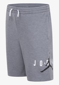 Pilkos sportinės šortai, pagaminti iš minkštos medžiagos, su elastine juosta ir raišteliu, taip pat didelis juodas Jumpman logotipas su "JORDAN" tekstu.